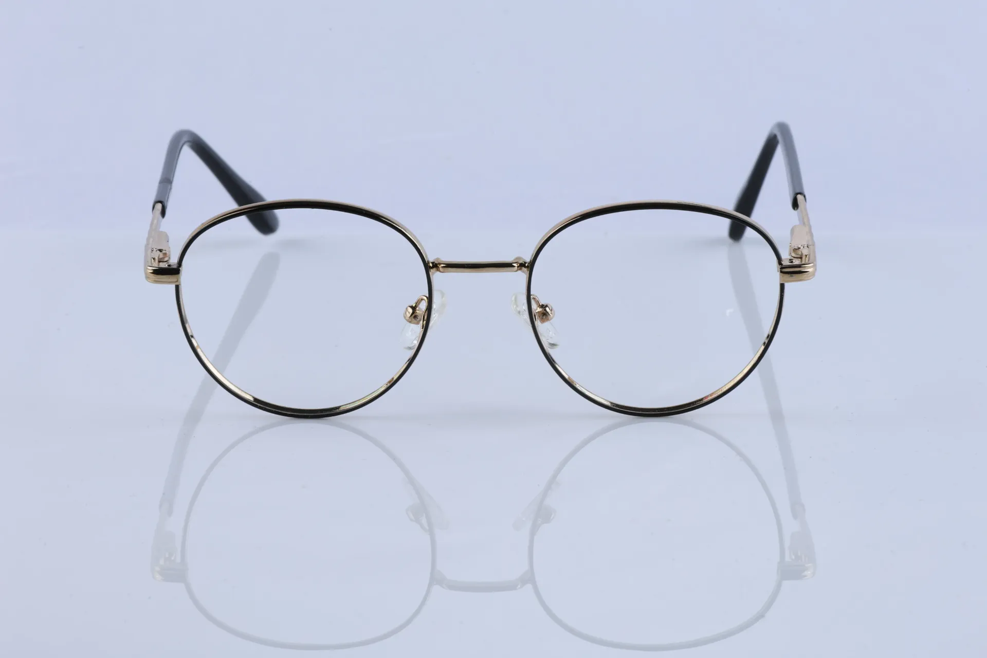 Retro Round Dual-Tone Frames in Polished Gold & Onyx Black